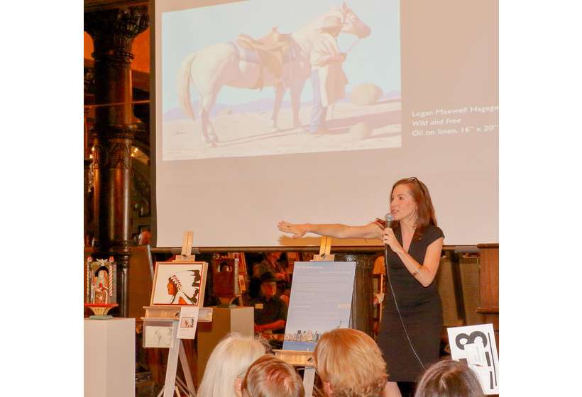 Auctioneer Alissa Ford fires up the crowd for Logan Maxwell Hagege’s "Wild and Free," which was the 2017 Gala’s co-top gainer at $12,000.