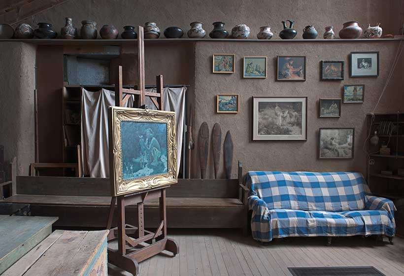 South wall of Couse’s studio showing his paintings and Native American pottery collection.