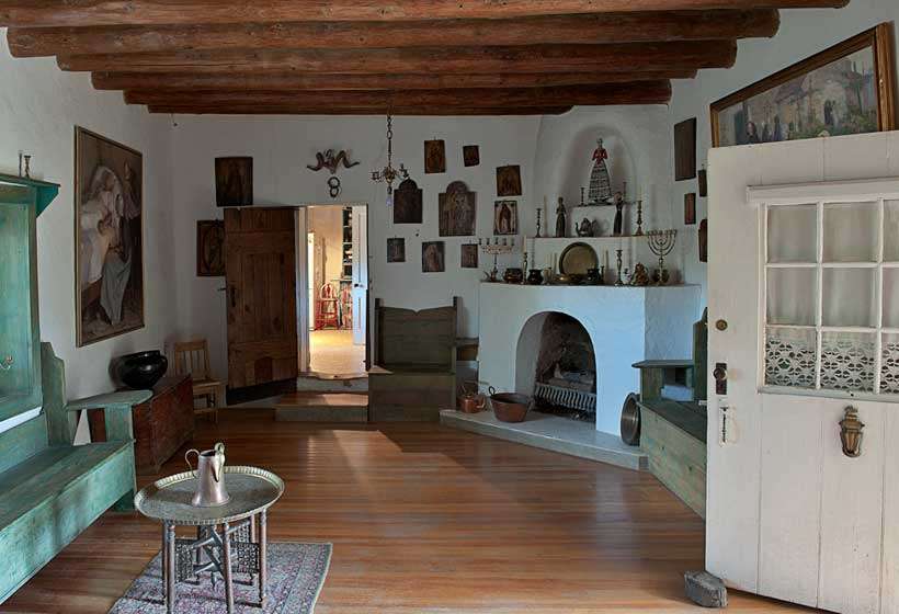 Couse living room showing some of the Couse collections of santos and retablos.